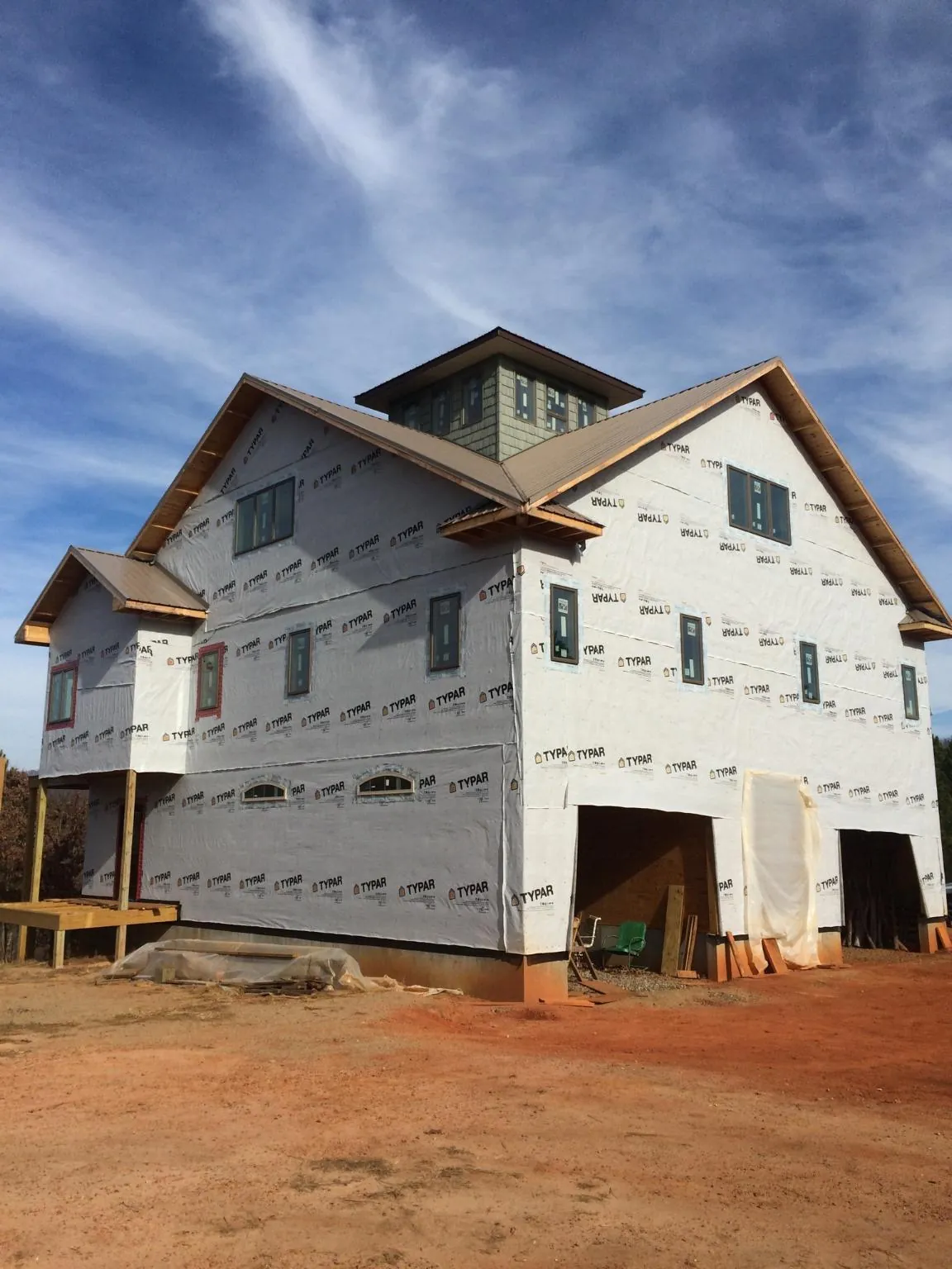 New two story house under construction with a cupola and gabled roofs in Zanesfield
